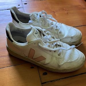 White Veja sneakers with pink and black accents